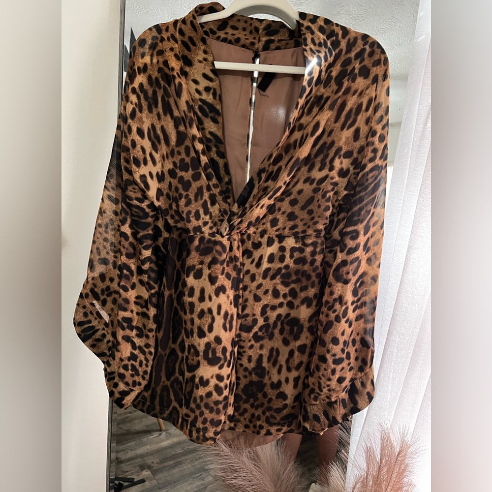 Leopard print boutique dress. Size M. It is on the shorter side. - Picture 2 of 3